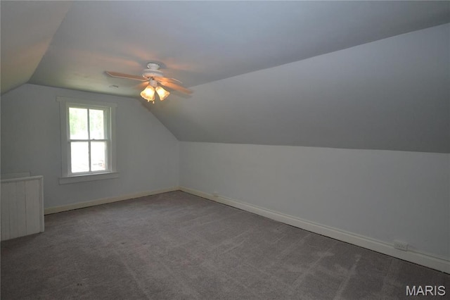 103 N Delaware Ave, Belleville, IL 62221 - additional living space with vaulted ceiling, baseboards, carpet flooring, and a ceiling fan