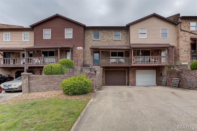 1811 Ramada Blvd Unit 6, Collinsville, IL 62234 - view of property featuring driveway, a garage, and brick siding