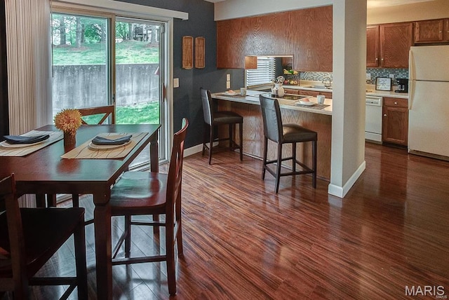 1811 Ramada Blvd Unit 6, Collinsville, IL 62234 - dining space with dark wood-type flooring and baseboards