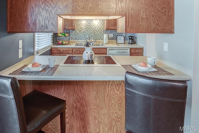 1811 Ramada Blvd Unit 6, Collinsville, IL 62234 - kitchen with a sink, electric stovetop, dishwasher, and light countertops