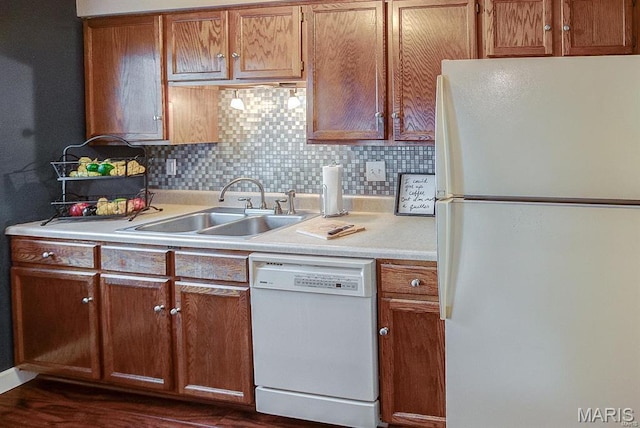 1811 Ramada Blvd Unit 6, Collinsville, IL 62234 - kitchen featuring white appliances, a sink, light countertops, decorative backsplash, and dark wood-style flooring