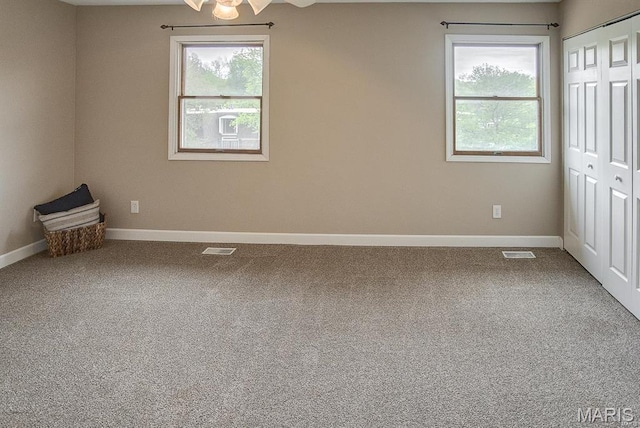 1811 Ramada Blvd Unit 6, Collinsville, IL 62234 - unfurnished bedroom featuring multiple windows, baseboards, and carpet floors