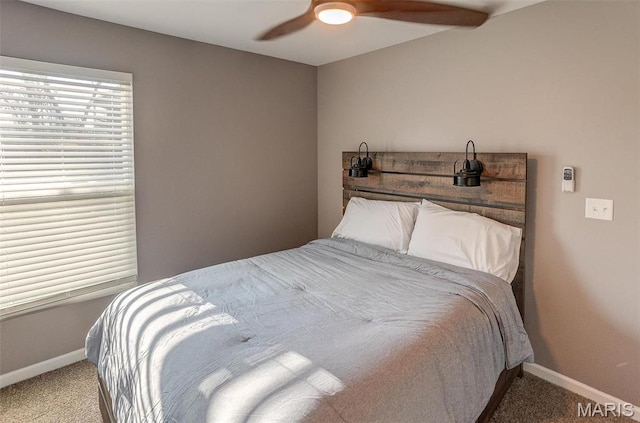bedroom with carpet, baseboards, and ceiling fan