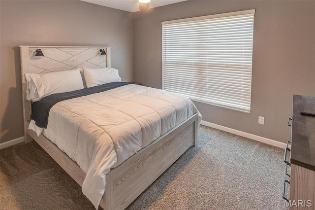 bedroom with carpet floors and baseboards
