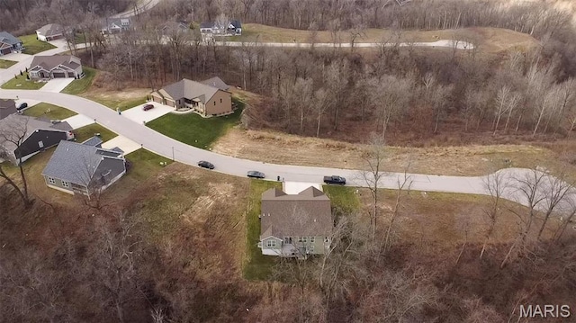 aerial view of property and surrounding area with nearby suburban area