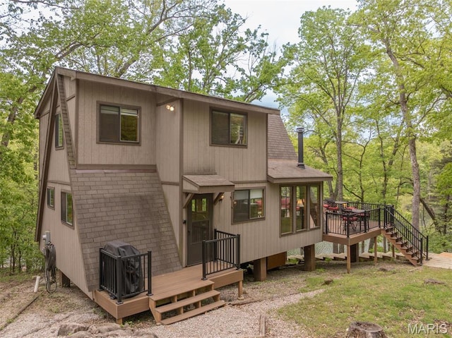 2399 Kitzbuhl Bend Dr, Innsbrook, MO 63390 - back of house with a deck, a shingled roof, and stairs