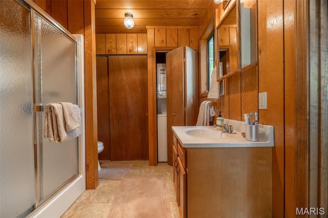 2399 Kitzbuhl Bend Dr, Innsbrook, MO 63390 - full bath featuring wood walls, a stall shower, vanity, and toilet