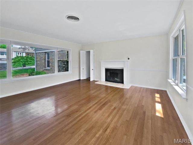 246 Barter Ave, Saint Louis, MO 63122 - unfurnished living room featuring wood finished floors, a glass covered fireplace, and baseboards