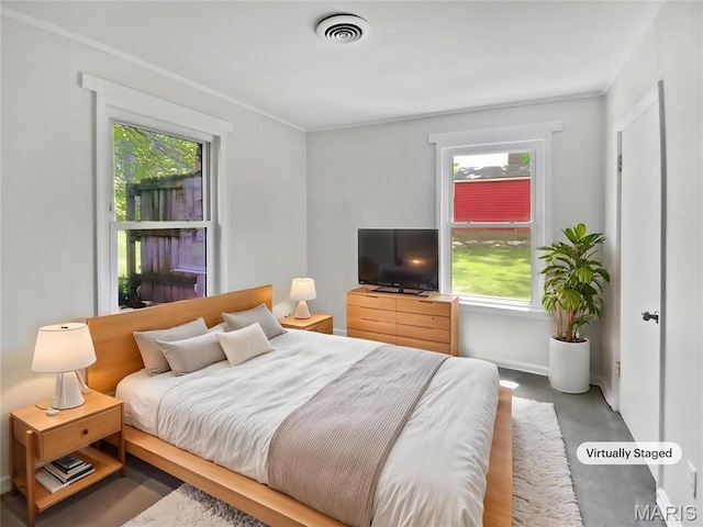 246 Barter Ave, Saint Louis, MO 63122 - bedroom featuring concrete flooring, crown molding, and baseboards