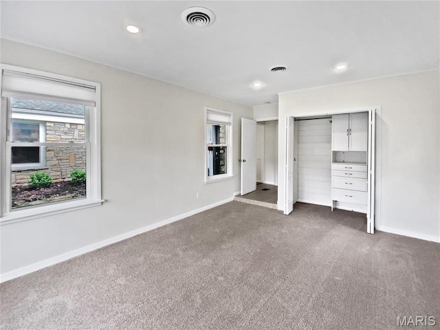 246 Barter Ave, Saint Louis, MO 63122 - unfurnished bedroom featuring dark colored carpet, multiple windows, baseboards, a closet, and recessed lighting