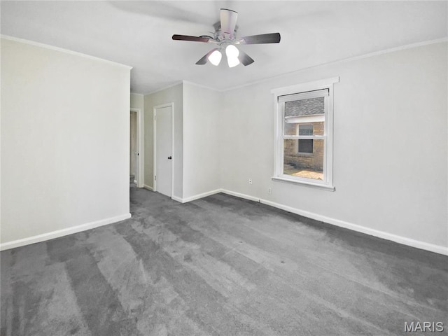 246 Barter Ave, Saint Louis, MO 63122 - spare room featuring ceiling fan, baseboards, dark colored carpet, and crown molding