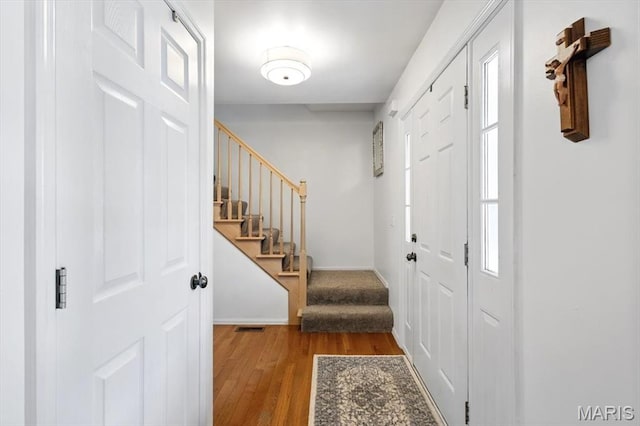 17282 Hilltop Ridge Dr, Eureka, MO 63025 - foyer featuring wood finished floors and stairs