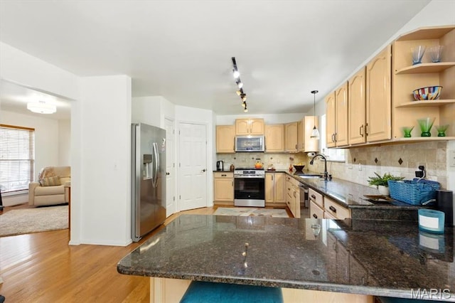 17282 Hilltop Ridge Dr, Eureka, MO 63025 - kitchen with appliances with stainless steel finishes, a sink, light brown cabinetry, a peninsula, and open shelves