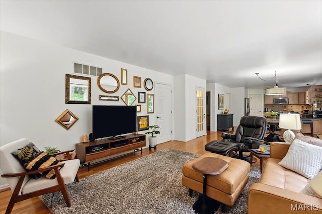 17282 Hilltop Ridge Dr, Eureka, MO 63025 - living room with light wood-type flooring and baseboards