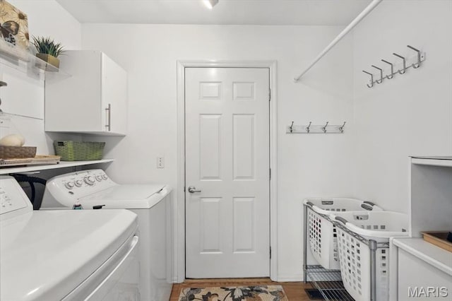 17282 Hilltop Ridge Dr, Eureka, MO 63025 - clothes washing area with cabinet space, independent washer and dryer, and wood finished floors