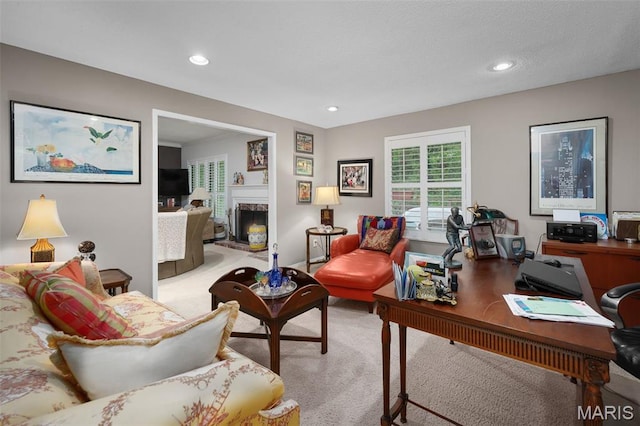 2013 Trailcrest Ln Unit 7, Saint Louis, MO 63122 - living area featuring a desk, light carpet, a fireplace, and recessed lighting