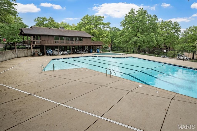2013 Trailcrest Ln Unit 7, Saint Louis, MO 63122 - community pool with fence, view of scattered trees, and a patio area