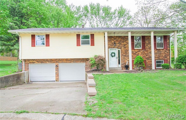 504 Leawood Dr, Swansea, IL 62226 - split foyer home with a garage, a front lawn, concrete driveway, and brick siding