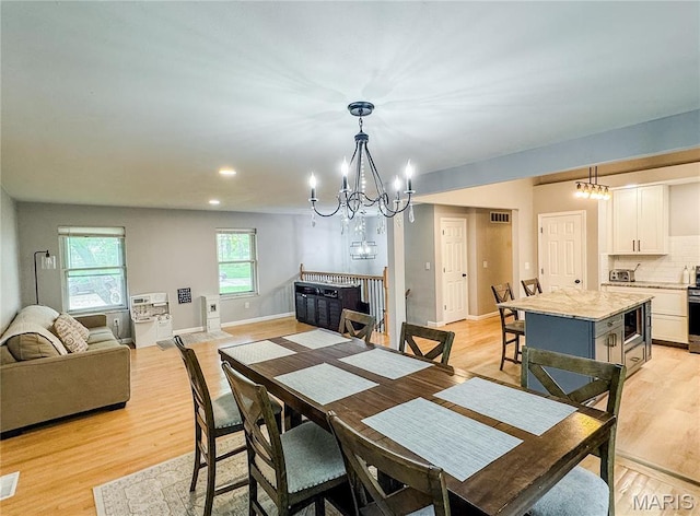 504 Leawood Dr, Swansea, IL 62226 - dining space featuring a chandelier, light wood-style floors, baseboards, and recessed lighting