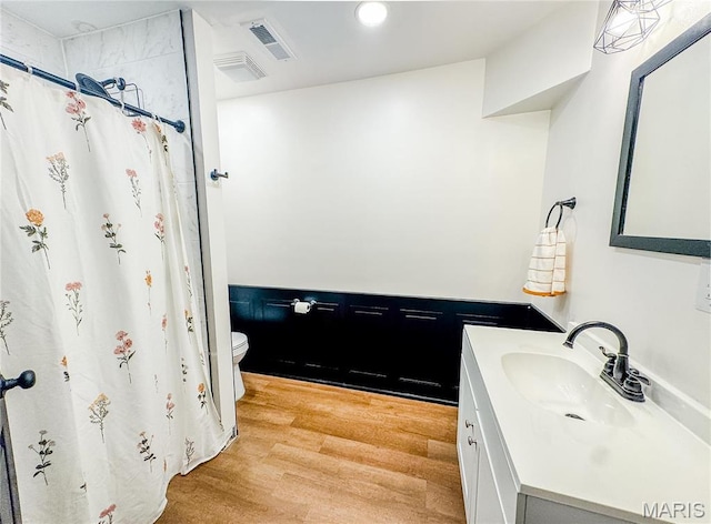 504 Leawood Dr, Swansea, IL 62226 - bathroom with vanity, toilet, wood finished floors, a shower with shower curtain, and recessed lighting