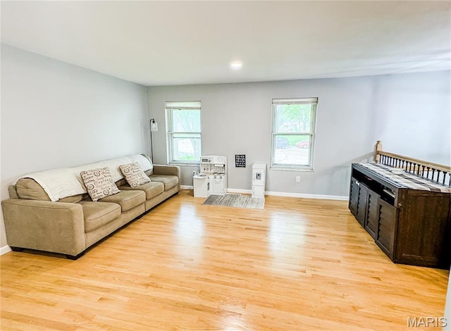 504 Leawood Dr, Swansea, IL 62226 - living area featuring light wood-type flooring, healthy amount of natural light, and baseboards