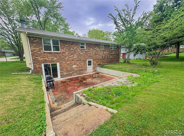 504 Leawood Dr, Swansea, IL 62226 - rear view of house with brick siding, a lawn, a patio, and a chimney