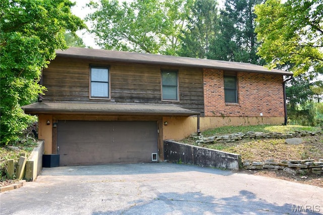 258 Hideaway Trl, Eureka, MO 63025 - view of front of home featuring driveway, a garage, and brick siding