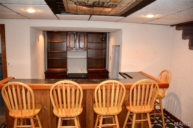 258 Hideaway Trl, Eureka, MO 63025 - dining room featuring bar, a drop ceiling, and baseboards
