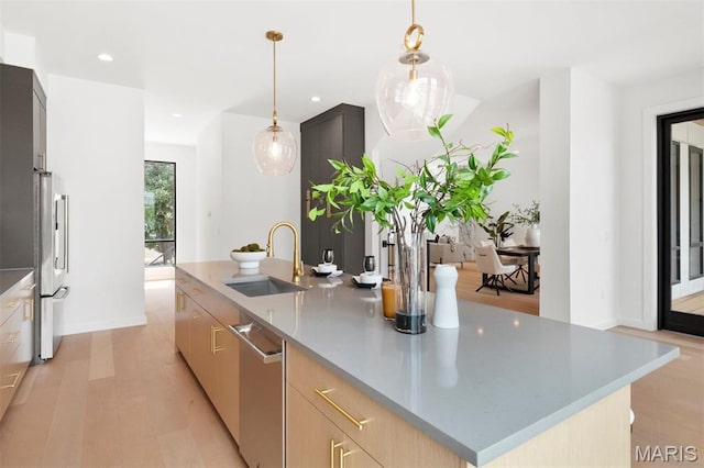 215 N Sarah St Unit 12, Saint Louis, MO 63108 - kitchen with a sink, stainless steel appliances, modern cabinets, recessed lighting, and pendant lighting