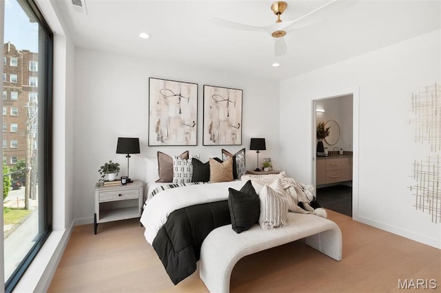 215 N Sarah St Unit 12, Saint Louis, MO 63108 - bedroom with wood finished floors, ensuite bathroom, baseboards, recessed lighting, and a ceiling fan