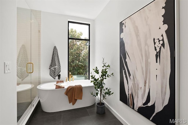 215 N Sarah St Unit 12, Saint Louis, MO 63108 - full bathroom featuring tile patterned floors, a shower stall, and a soaking tub