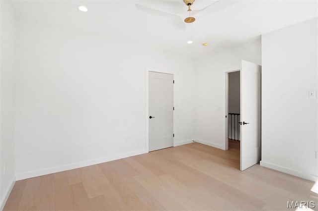 215 N Sarah St Unit 12, Saint Louis, MO 63108 - unfurnished bedroom with light wood-style flooring, baseboards, and recessed lighting