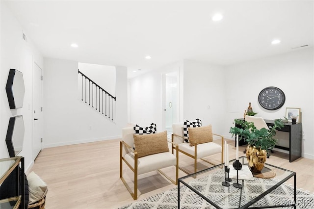 215 N Sarah St Unit 12, Saint Louis, MO 63108 - living area featuring light wood finished floors, stairs, recessed lighting, and baseboards