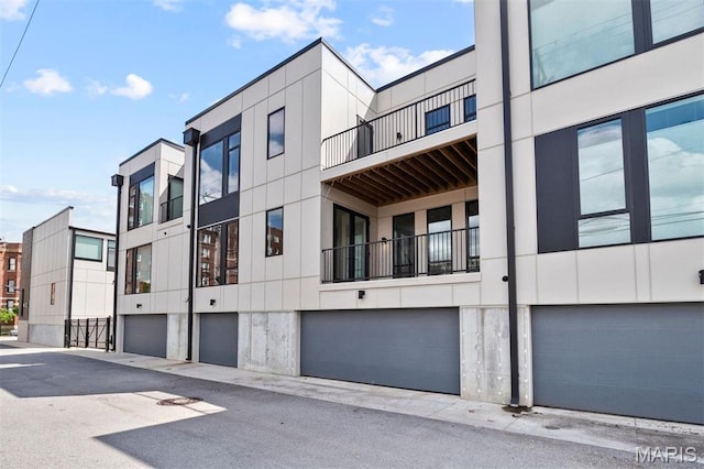 215 N Sarah St Unit 12, Saint Louis, MO 63108 - view of building exterior featuring an attached garage