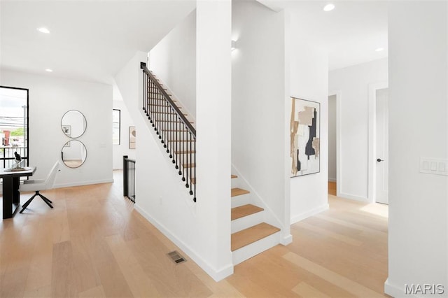 215 N Sarah St Unit 12, Saint Louis, MO 63108 - stairway featuring wood finished floors, recessed lighting, and baseboards