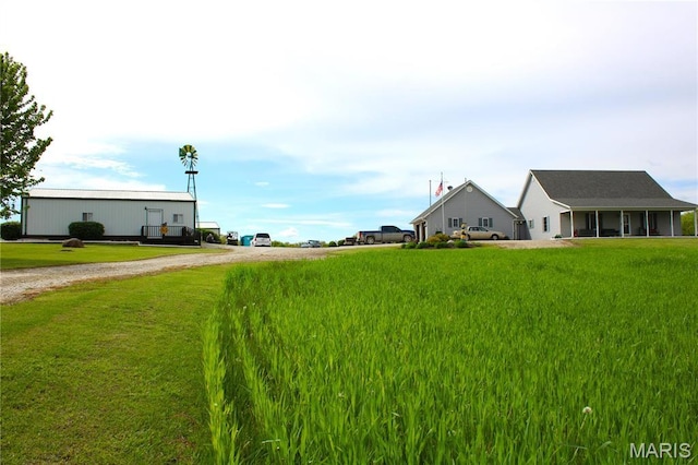 16255 Monroe Rd Unit 875, Paris, MO 65275 - view of green lawn featuring gravel driveway