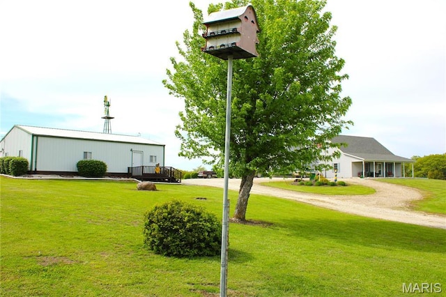 16255 Monroe Rd Unit 875, Paris, MO 65275 - surrounding community featuring a yard, driveway, and a wooden deck