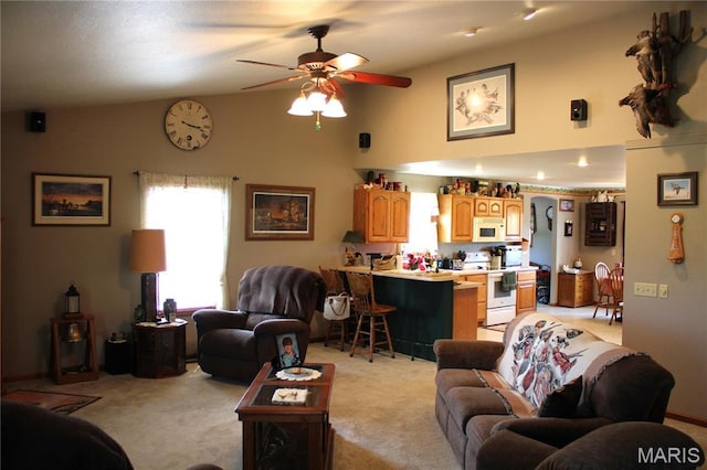 16255 Monroe Rd Unit 875, Paris, MO 65275 - living area featuring light colored carpet, ceiling fan, and high vaulted ceiling