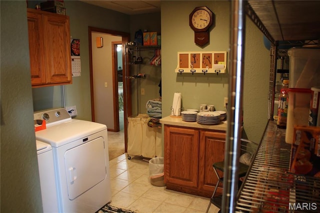 16255 Monroe Rd Unit 875, Paris, MO 65275 - laundry room featuring washer and dryer, cabinet space, and light tile patterned floors