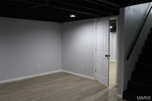 2530 N Waterford Dr, Florissant, MO 63033 - finished below grade area featuring stairway, light wood finished floors, and baseboards