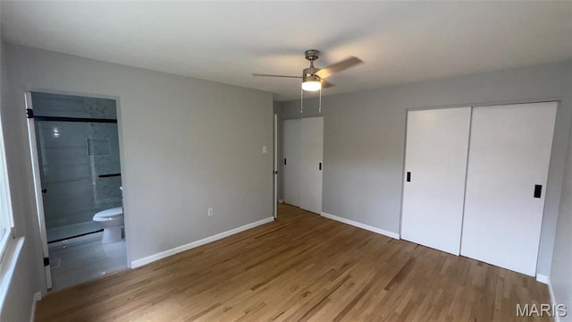 2530 N Waterford Dr, Florissant, MO 63033 - unfurnished bedroom featuring wood finished floors, baseboards, and a closet