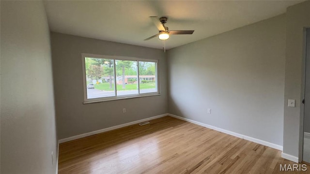 2530 N Waterford Dr, Florissant, MO 63033 - spare room featuring ceiling fan, light wood finished floors, and baseboards