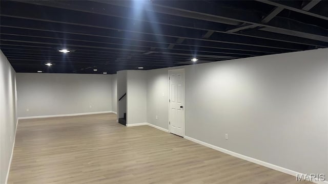 2530 N Waterford Dr, Florissant, MO 63033 - finished below grade area featuring light wood-style floors and baseboards