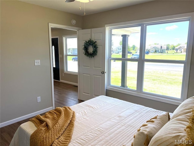 201 S Ashbrook, Bethalto, IL 62010 - bedroom with baseboards and dark wood finished floors