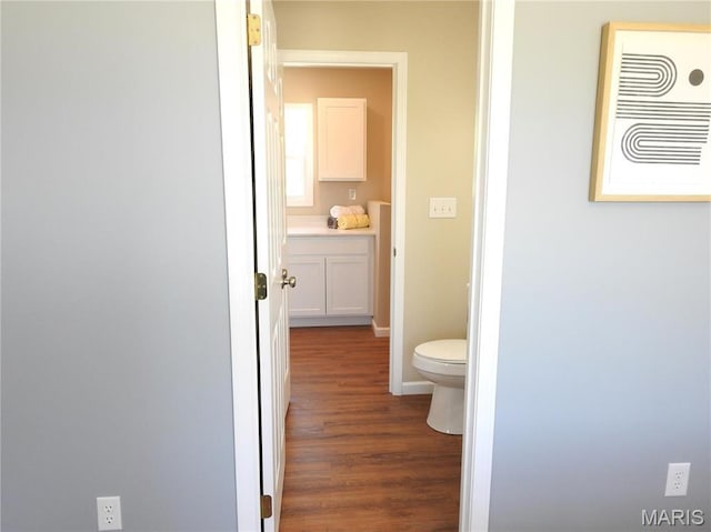201 S Ashbrook, Bethalto, IL 62010 - bathroom featuring wood finished floors, toilet, and baseboards