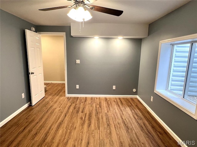 201 S Ashbrook, Bethalto, IL 62010 - empty room with ceiling fan, wood finished floors, and baseboards