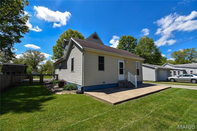 back of house featuring entry steps and a garage