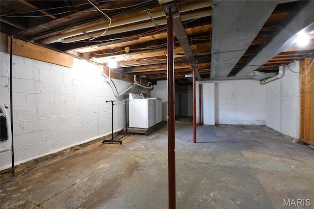 unfinished basement with washer / clothes dryer