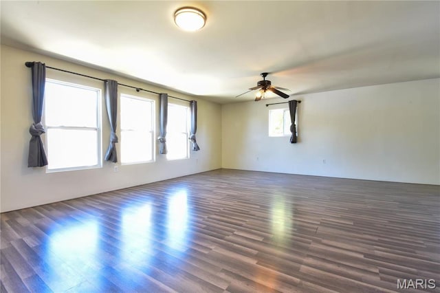 unfurnished room featuring ceiling fan and wood finished floors