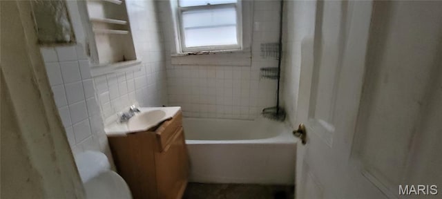 5144 Palm St, Saint Louis, MO 63115 - full bath featuring vanity, toilet, shower / tub combination, and tile walls